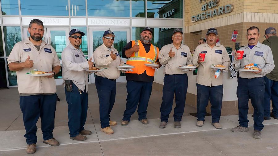 A City of Mission crew standing together outside a city building.